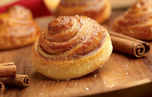 Delicious Cinnamon Bun Topped With Cinnamon Spice Wallpaper