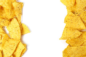 Delightful Spread Of Crunchy Tortilla Chips With Pepper Speckles Wallpaper