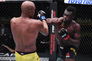 Derek Brunson In Mma Fighting Stance Wallpaper