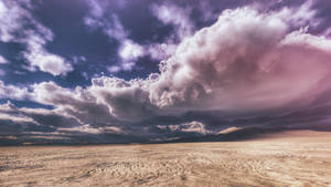 Desert Under Dense Clouds Wallpaper
