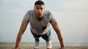 Determined African Man During Workout Wallpaper