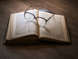 Dictionary Book With Eyeglasses Wallpaper