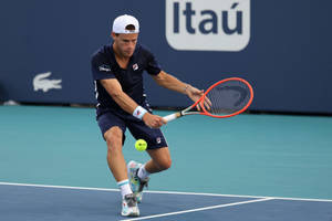 Diego Schwartzman Hitting The Ball Wallpaper