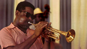 Dizzy Gillespie Presenting An Intricate Jazz Solo On His Trumpet Wallpaper