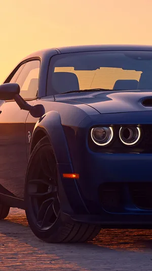 Dodge Challenger With Glowing Headlights Wallpaper