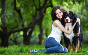 Dog And Girl In A Field Wallpaper