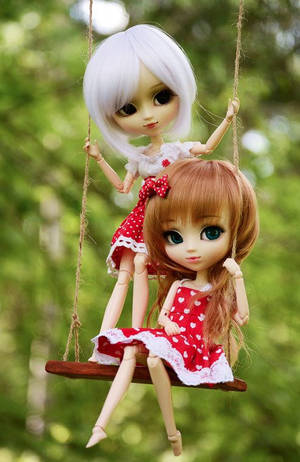 Dolls On A Swing Wallpaper