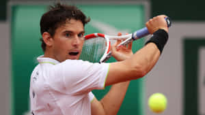 Dominic Thiem Intense Tennis Match Action Wallpaper