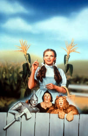 Dorothy And Friends Follow The Yellow Brick Road To Oz Wallpaper