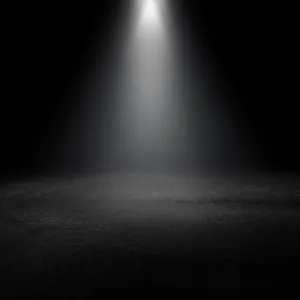 Dramatic Spotlight On A Dark Stage Wallpaper