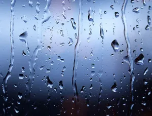 Dripping Raindrops On A Glass Pane Wallpaper