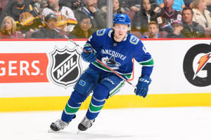 Dynamic And Focused Brock Boeser In Action During 2018 Nhl Game Wallpaper