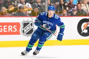 Dynamic And Focused Brock Boeser In Action During 2018 Nhl Game Wallpaper