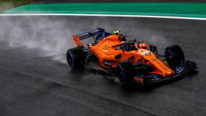 Dynamic Lando Norris In Action On The Track Wallpaper