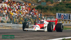 Dynamic View Of A Marlboro Race Car At The Indianapolis 500 Wallpaper