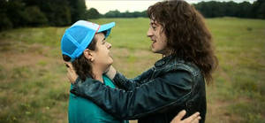 Eddie Munson And Dustin Henderson Hugging Wallpaper