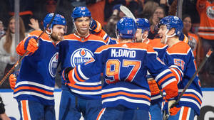 Edmonton Oilers Darnell Nurse Celebrating With Teammates Wallpaper