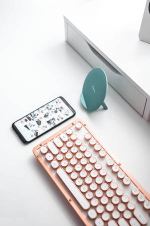 Efficient Workspace With Iphone And Keyboard Wallpaper