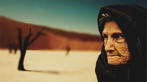 Elderly Woman In Desert Wallpaper