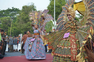 Elegance In Tradition - A Woman In Beautiful Batik Dress Wallpaper