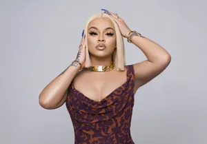 Elegant Blonde Woman Posing Wallpaper