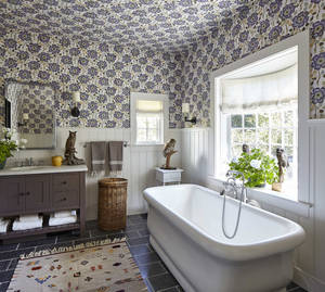 Elegant Lavender Bathtub Amidst Floral Beauty Wallpaper