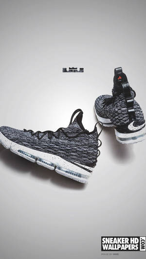 Elegant Lebron 15 Gray Sneaker Showcased On White Background Wallpaper