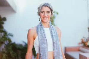 Elegant Older Woman In A Decorative Scarf Wallpaper