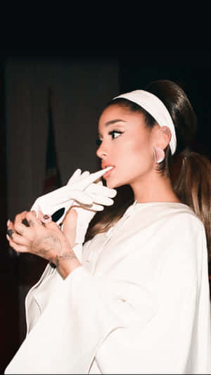 Elegant Singer White Outfit Wallpaper