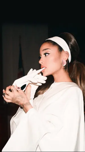 Elegant Singer White Outfit Wallpaper