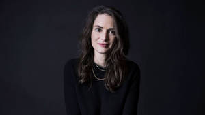 Elegant Winona Ryder In Formal Attire Wallpaper