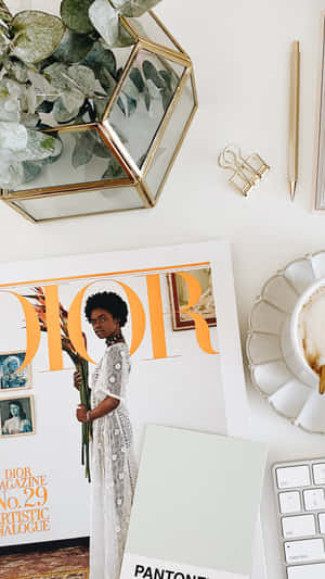 Elegant Workspacewith Dior Magazine Wallpaper