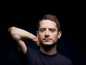 Elijah Wood On Black Background Wallpaper