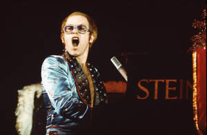 Elton John Classic Glam Concert Wallpaper
