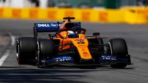 Embracing The Thrill Of Racing With Mclaren Formula 1 Wallpaper