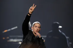 Eminem In Stage Peace Sign Wallpaper