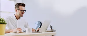 Employee's Coffee Bean Mug And Laptop Wallpaper