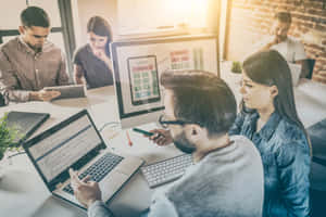 Employees Working On Project Management Wallpaper