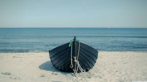 Empty Boat On The Beach Wallpaper