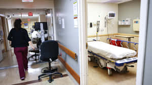 Empty Room With Vacant Hospital Bed Wallpaper