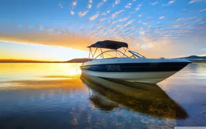 Empty Speed Boat Against Sunset Wallpaper