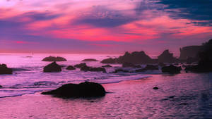 Enchanting Malibu Beach At Dusk Wallpaper