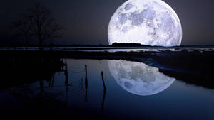 Enchanting View Of Galaxy Moon At Night Wallpaper