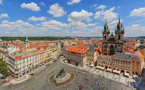 Enchanting View Of Prague City Center Under The Cloudy Sky. Wallpaper