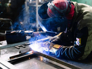 Engineer Welding A Metal Wallpaper