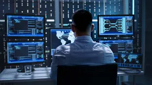 Engineer Working With Computers Wallpaper