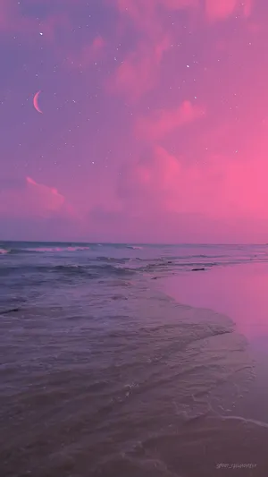 Enjoy A Beautiful Beach Sunset With A Pink And Tranquil Aesthetic. Wallpaper