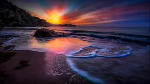 Enjoy A Day At The Beach With A Picturesque View. Wallpaper