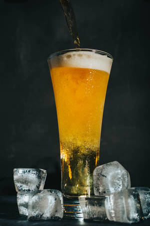 Enjoy A Refreshing Pint Of Beer Wallpaper