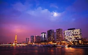 Enjoy A Romantic Evening In Paris Under The Starry Night Sky. Wallpaper